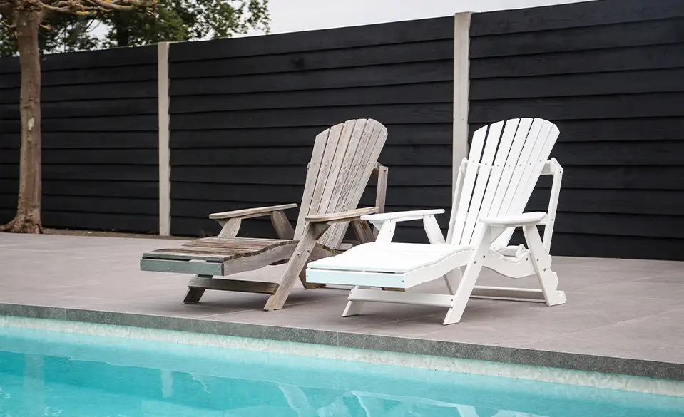 plastic sun lounger next to wooden sun lounger